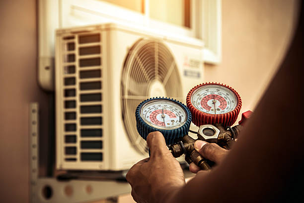 Professional Air Conditioning Service technician working in Oxford, AL
